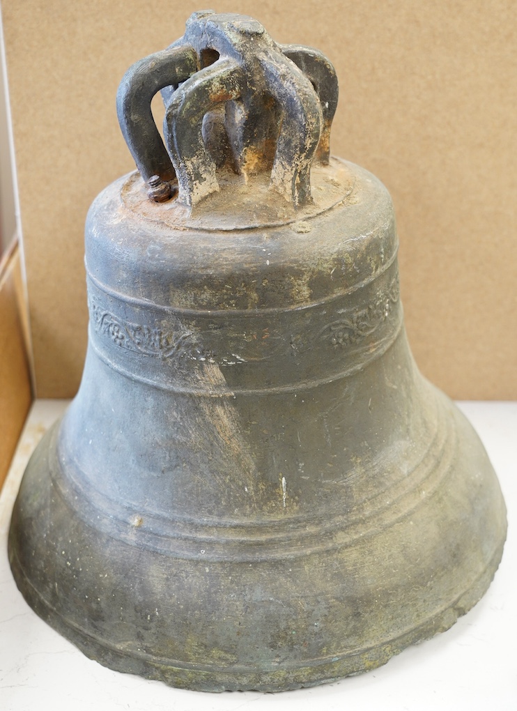 An 18th/19th century bronze bell, initialled TR, 33cm high. Condition - poor to fair, some losses to the rim